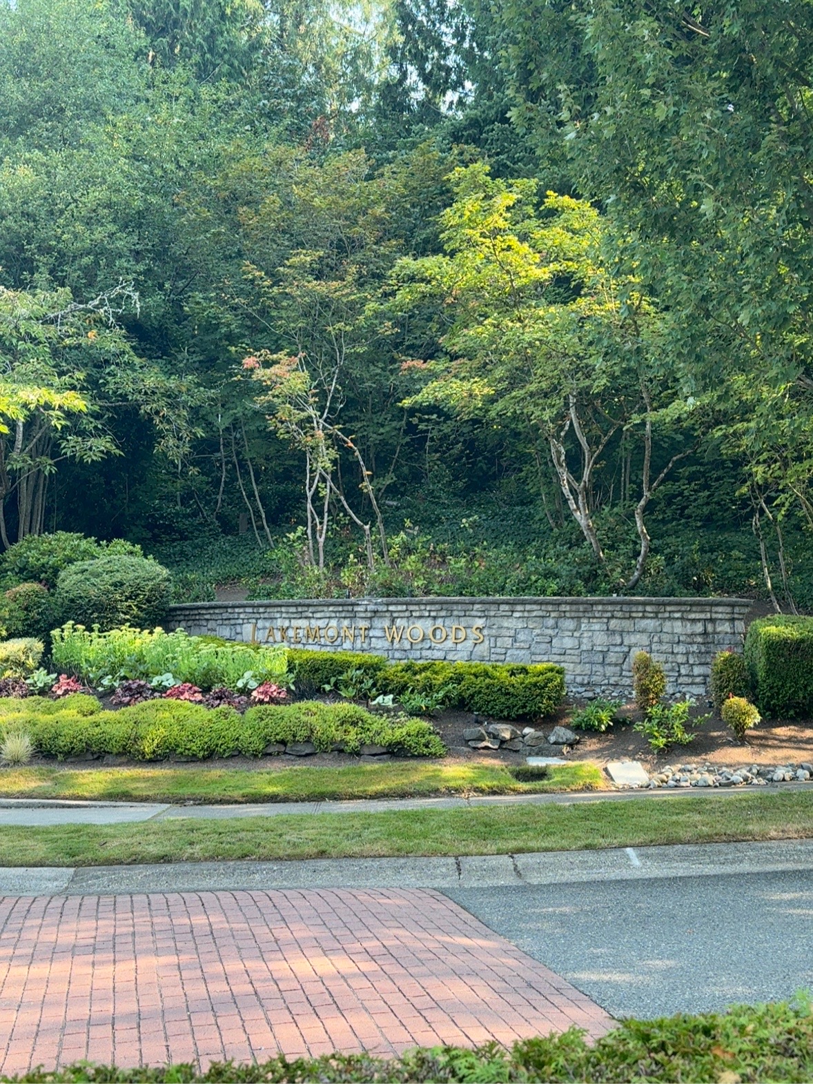Lakemont Woods stone entrance monument surrounded by landscaping